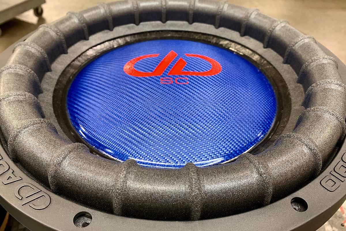 USA Made subwoofer with electric blue dust cap and red DDA logo with super charged decal