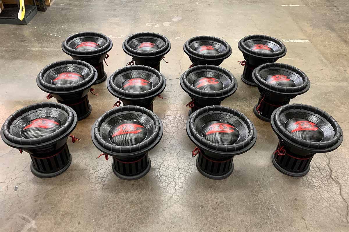 Twelve USA Made subwoofers - all black with red DD Z logos