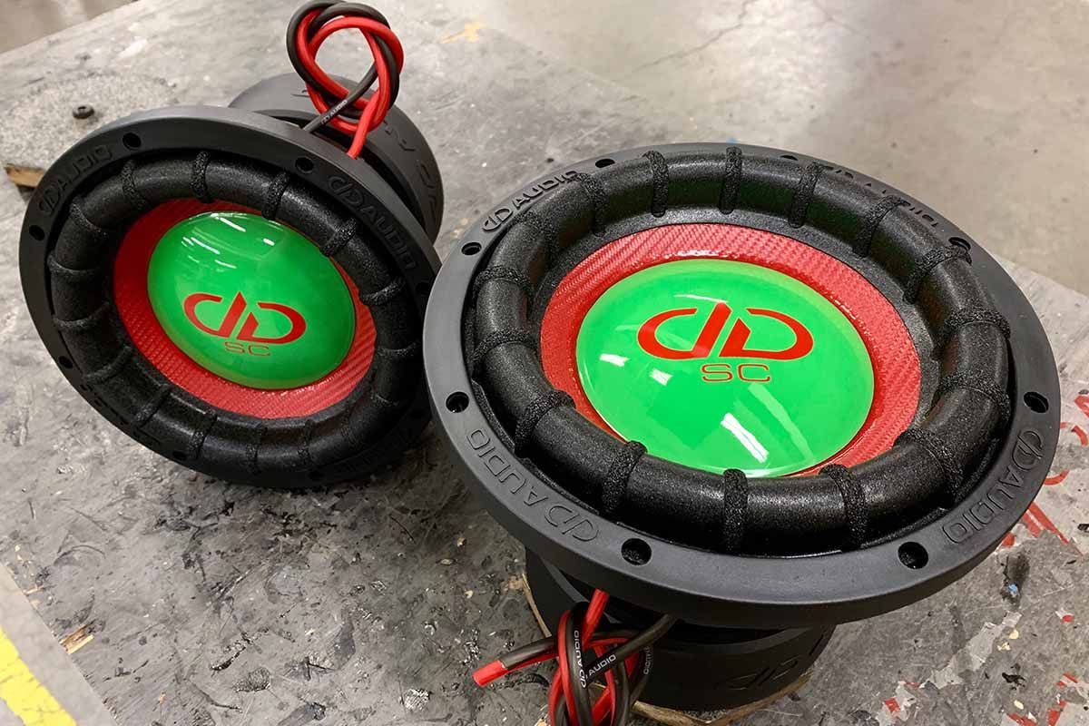 Two USA Made Subwoofers - cherry limeade or watermelon theme colors - red cones and lime green epoxy dust cap featuring red DDA logos and red super charged decals
