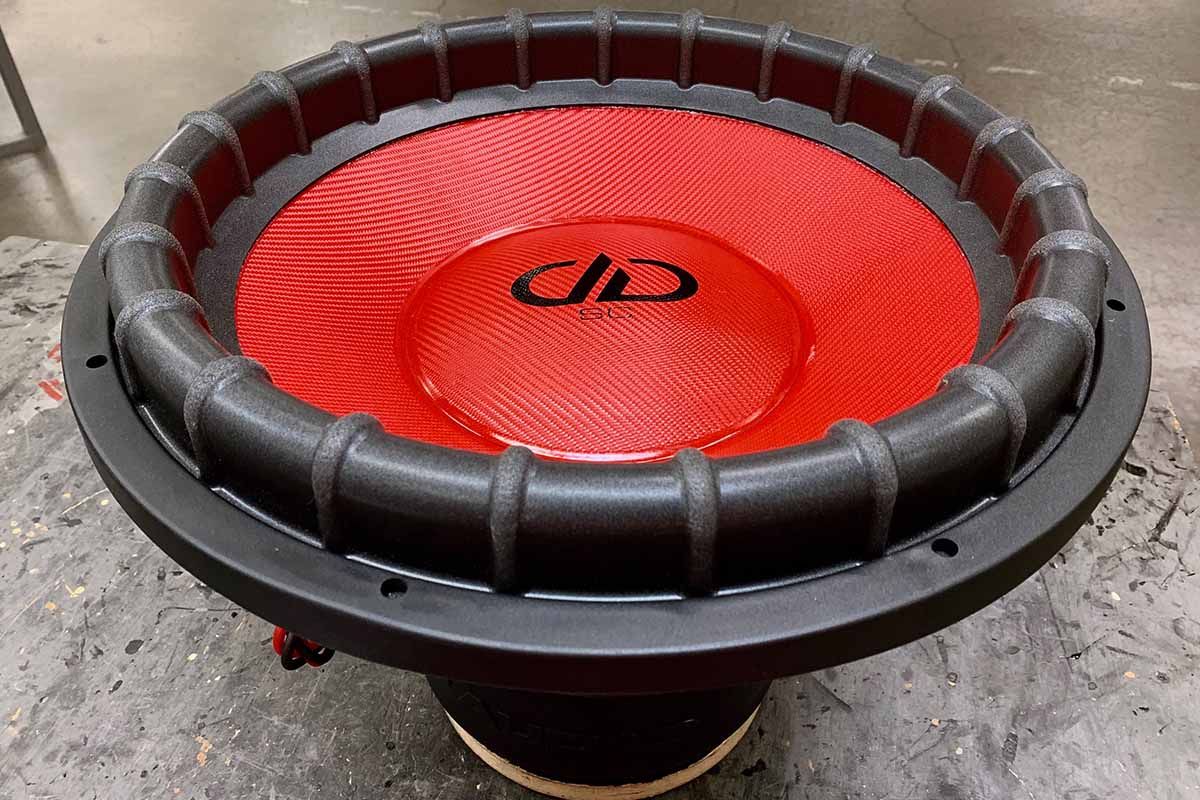 USA Made subwoofer with red cone, red dust cap, black DDA logo and black super charged decal