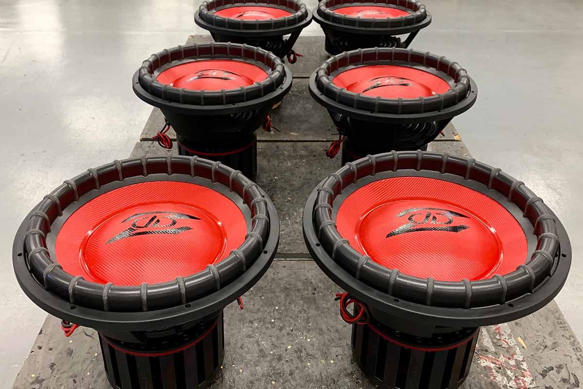 Six USA Made Subwoofers with red cones, red dust caps, and black DD Z logos