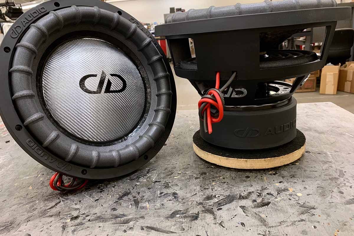 USA Made subwoofer with silver carbon fiber dust cap on black cone with black DDA logo