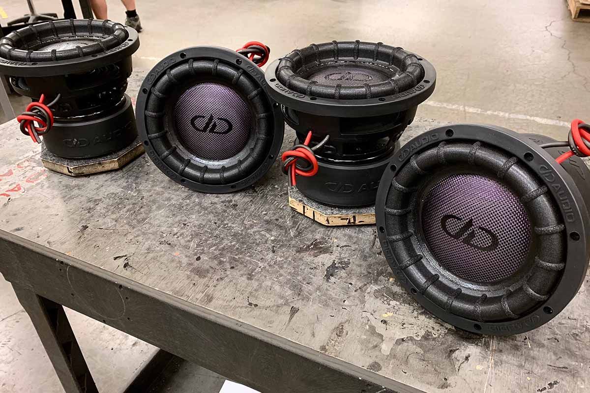 Four USA Made Subwoofers with polychromatic purple carbon fiber dust caps and black DDA logos
