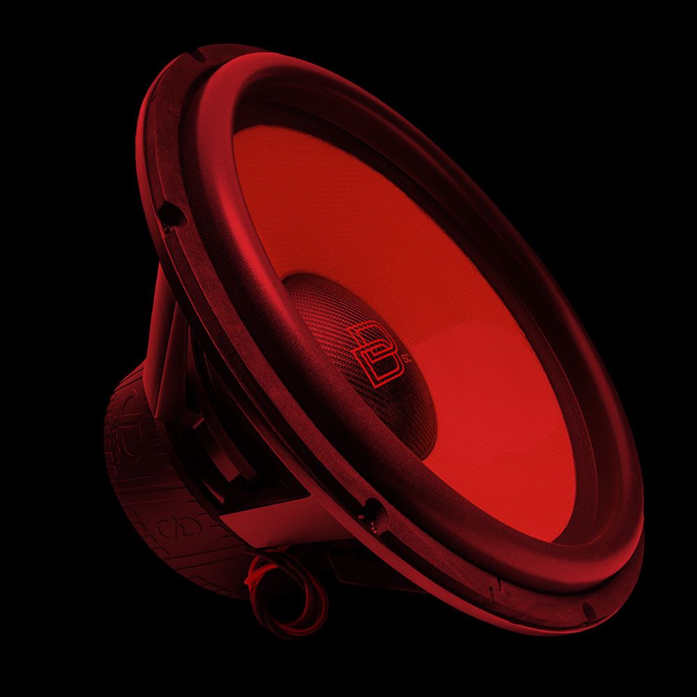 21 inch 9900 series revision c subwoofer slanted right showing motor frame and part of cone and dustcap with an overall red tint on photo