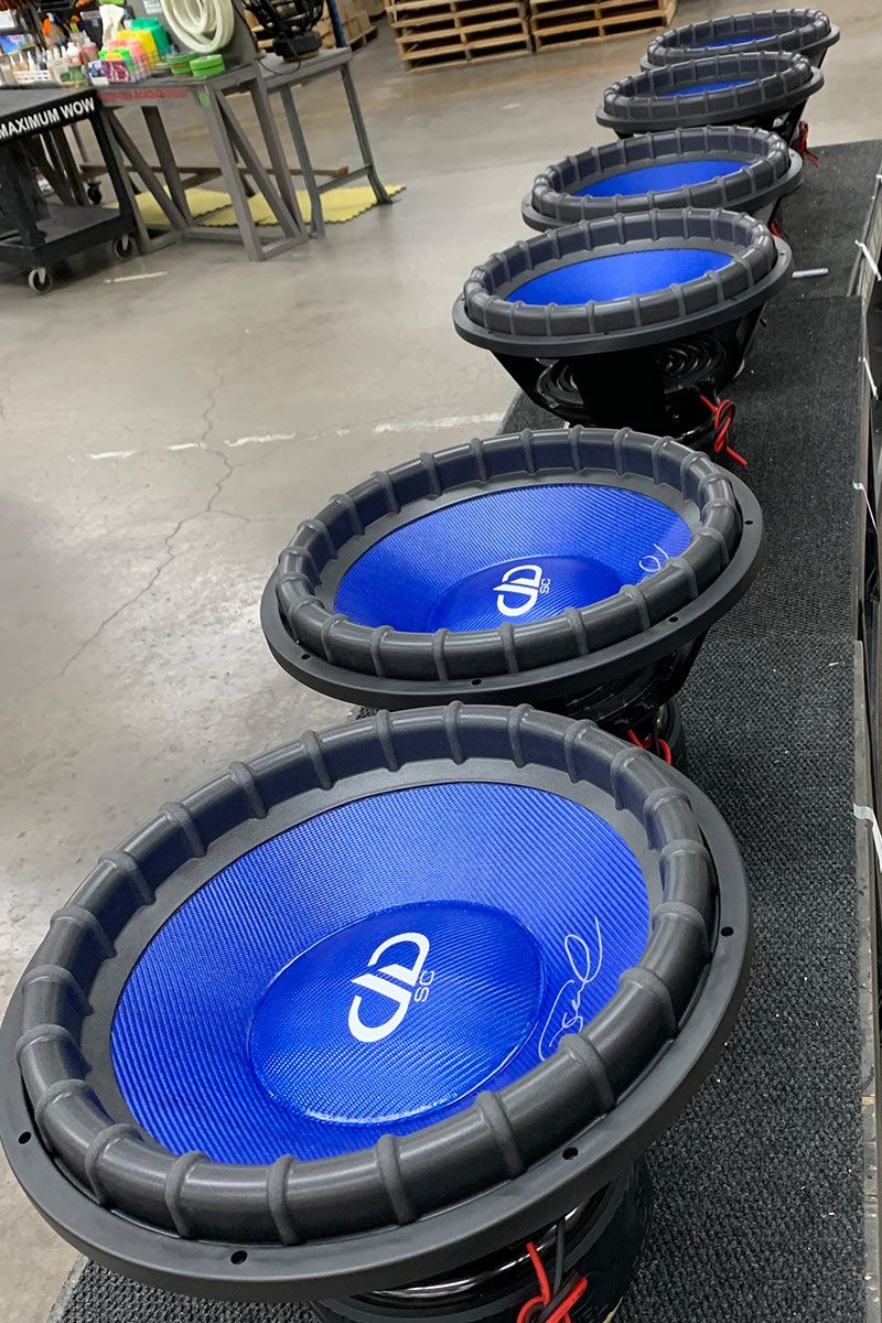 six 18 inch made in usa subwoofers with blue composite cone and dust caps with white DD and supercharged logos and silver signature