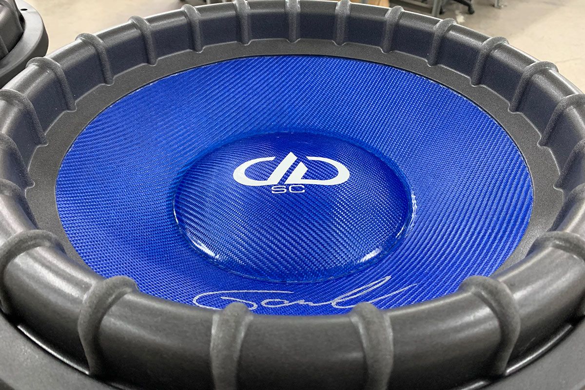 made in usa subwoofer with blue composite cone and dust cap with white DD and supercharged logos with silver signature