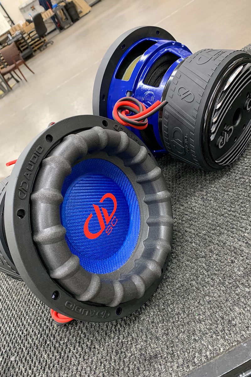 two 8 inch made in usa subwoofers with blue powder coated frames and red DD and supercharged logos
