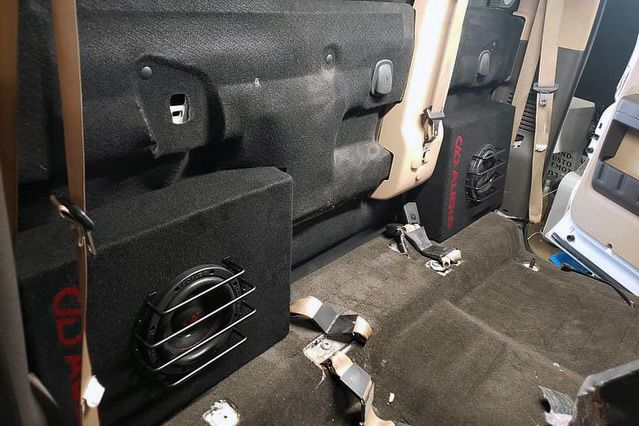 Photo of an LE-ST06 in truck behind seat - Impact Tint Audio