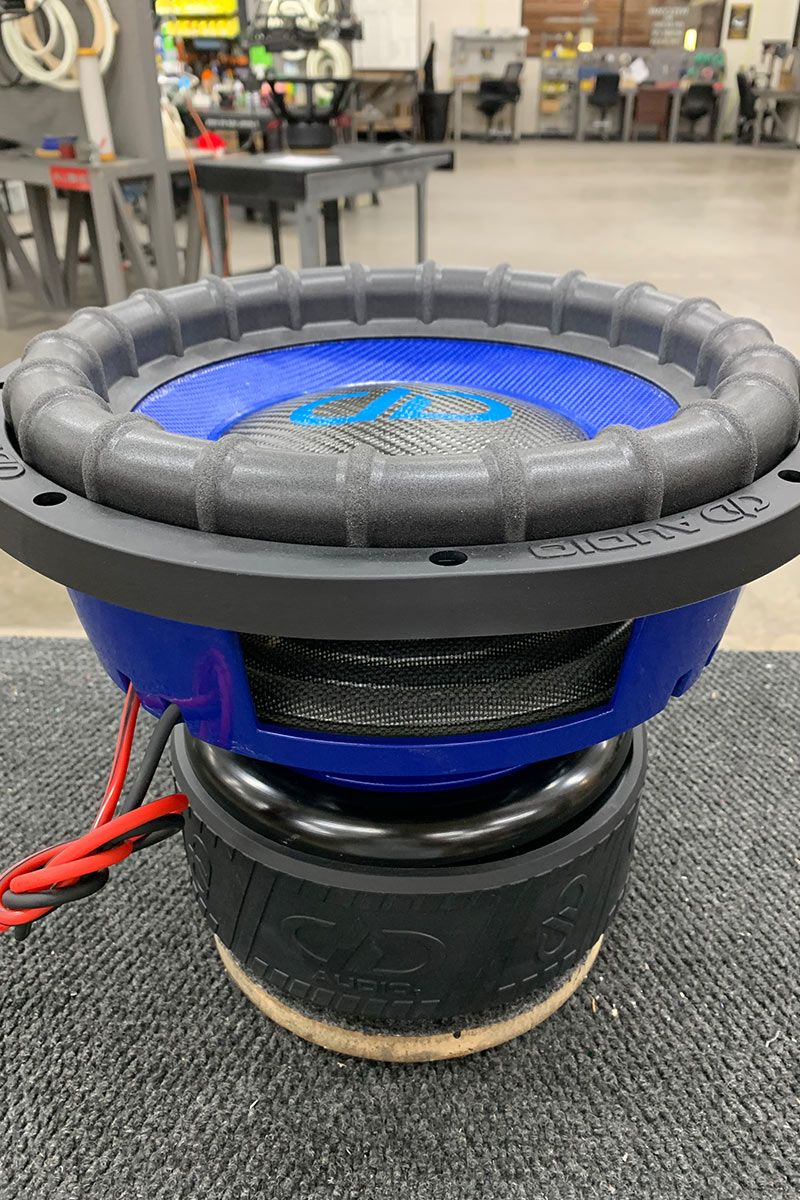 12 inch made in usa subwoofer with blue powder coated frame blue composite cone and black carbon fiber dust cap with light blue DD logo
