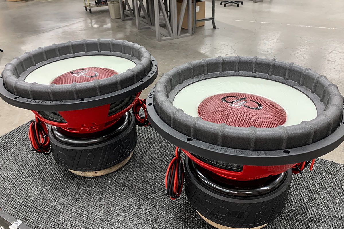 two 15 inch made in usa subwoofers with white composite ghost cone and red composite red dust cap with black DD logo and white supercharged logo