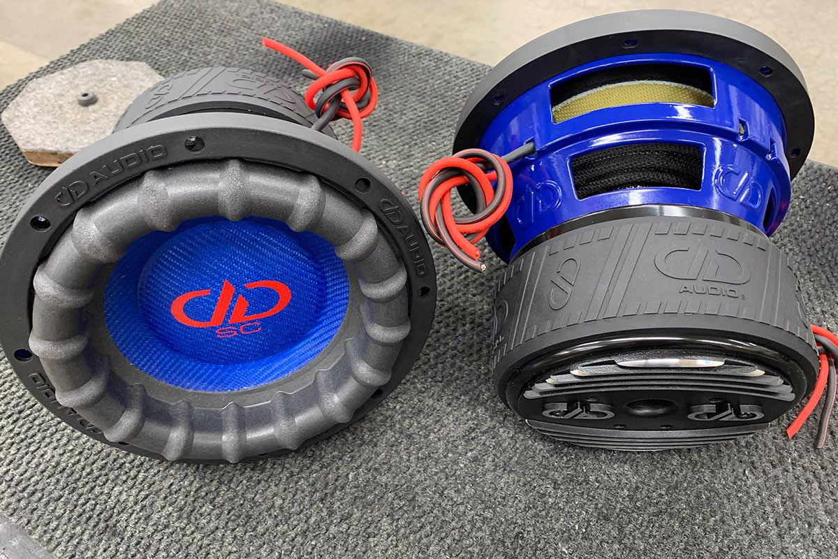 two 8 inch made in usa subwoofers with blue powder coated frames and red DD and supercharged logos