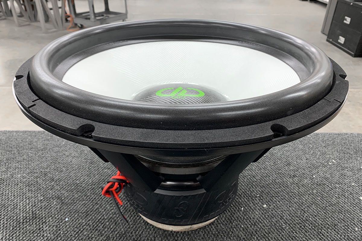 made in usa 21 inch 9900 subwoofer with white composite cone and black carbon fiber dust cap with green DD logo and green supercharged logo