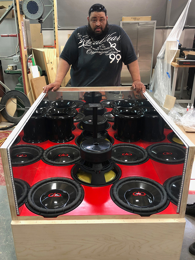 Photo of Lew with Enclosure Being Built
