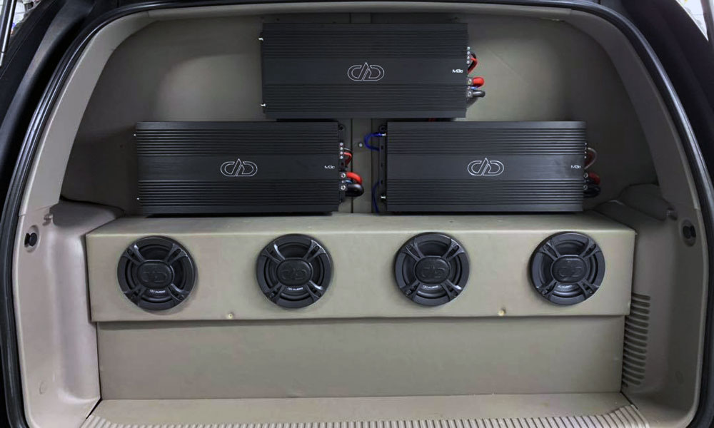 Photo of Custom work by Custom Audio - Amps and Coaxials in SUV rear