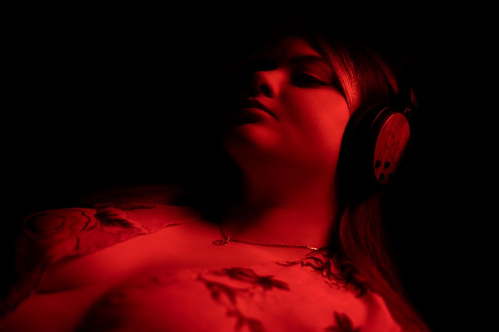 Photo of young woman relaxing with DXBT-05 headphones 