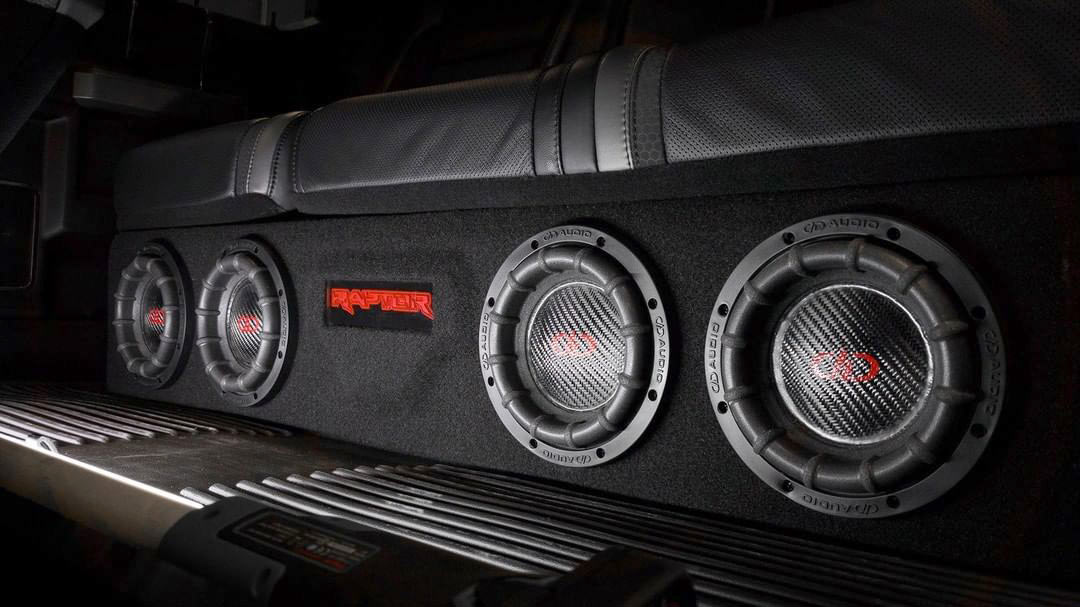 Photo of four 1506 Subwoofers installed in custom box under seat
