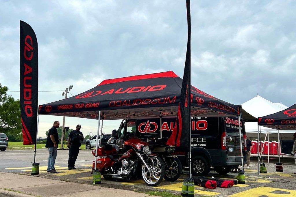 Photo of motorcycles under the dd audio tent at black wall street bike rally