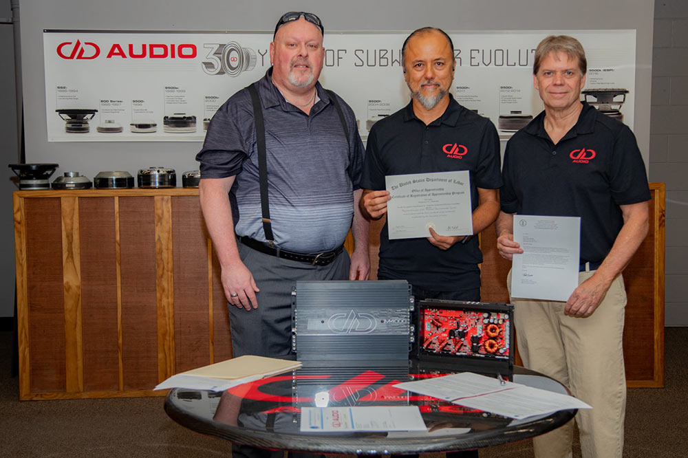 Photo persons at the amp repair apprenticeship signing ceremony