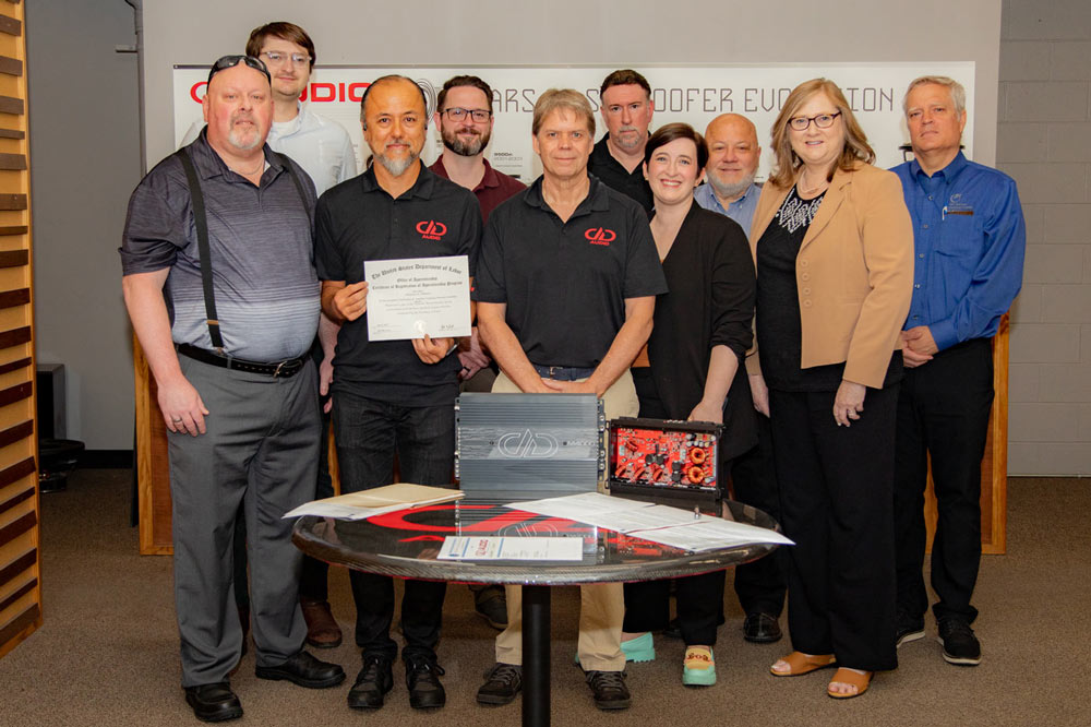 Photo of amp repair apprenticeship signing ceremony including persons from. DD Audio, Oklahoma Office of Workforce Development (OOWD), Oklahoma Department of Commerce, Oklahoma Manufacturing Association (OMA) and the US Department of Labor