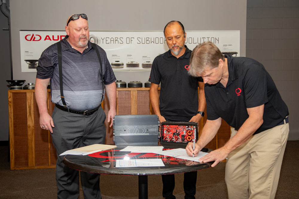 Photo persons at the amp repair apprenticeship signing ceremony