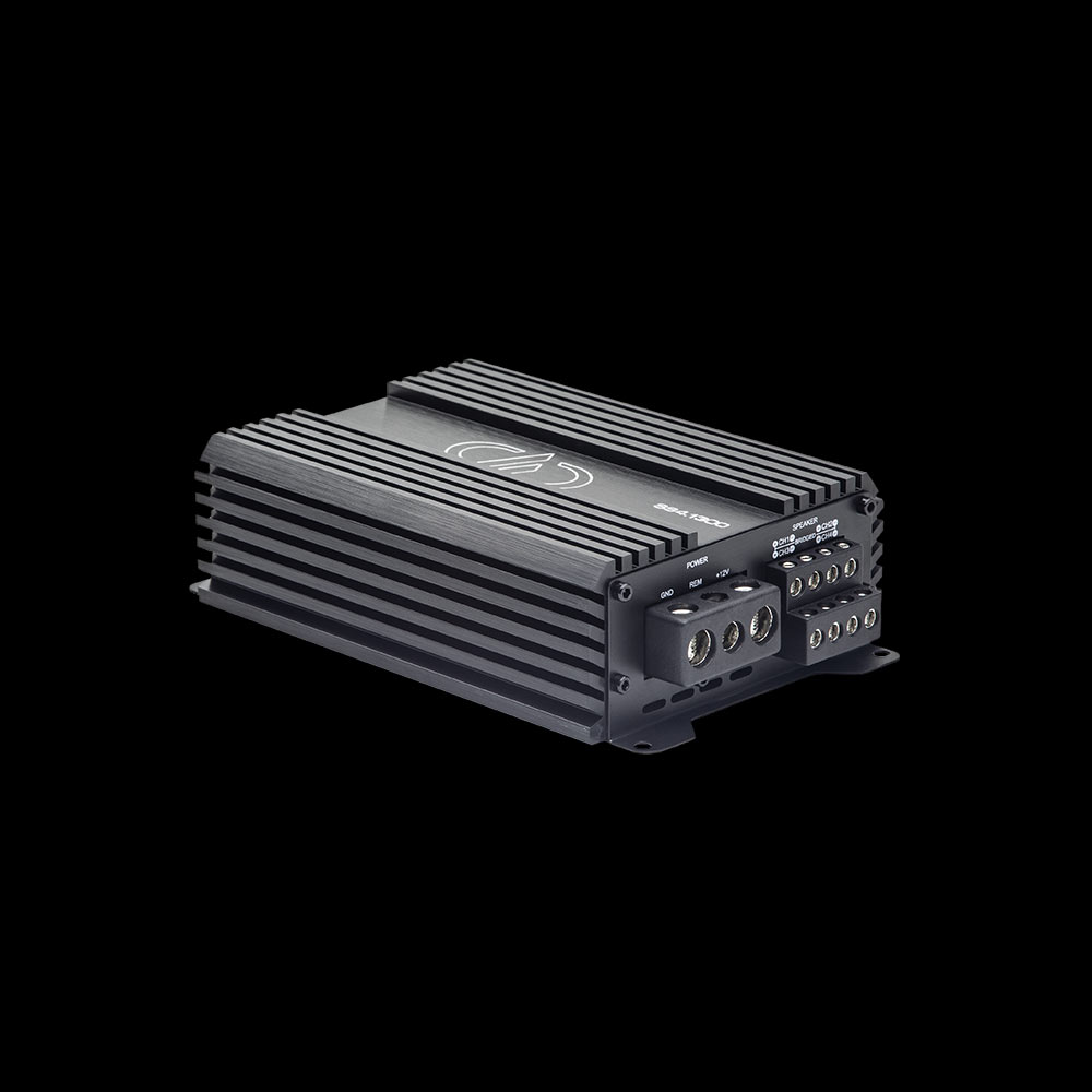 Photo of SS4.1300 shot at angle showing top plate, logo and model number with power and speaker connections on side