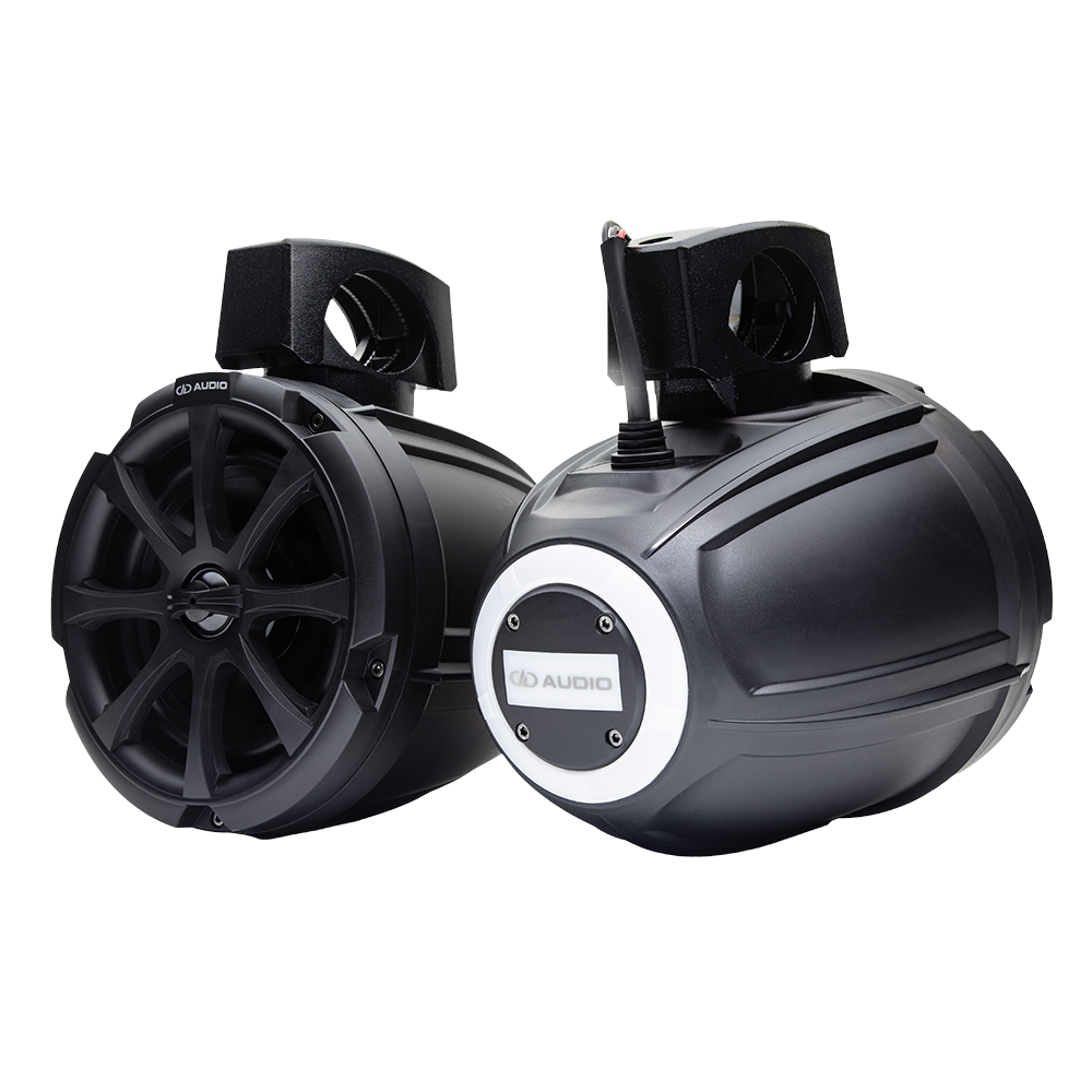 Photo of MC-106b pair - one facing front to show the grill, the other showing the back logo with a white glow