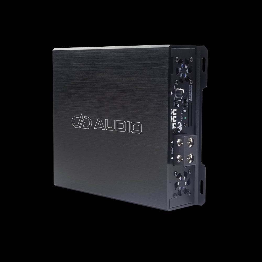 Photo of SPS on its side angled to show top plate with logo and model, and side panel with connection points and settings.