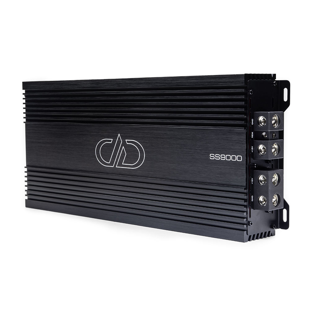 Photo of SS9000 on side showing full top plate with logo and model number, and part of end panel with power connection points