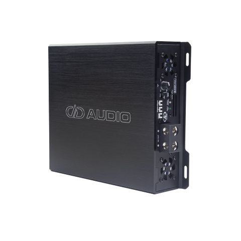 Photo of SPS on its side angled to show top plate with logo and model, and side panel with connection points and settings.